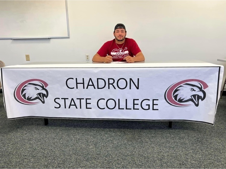 student behind table